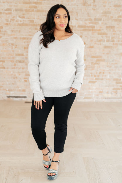 Plus size model wearing Lana Sweater Top with jeans for chic casual style.