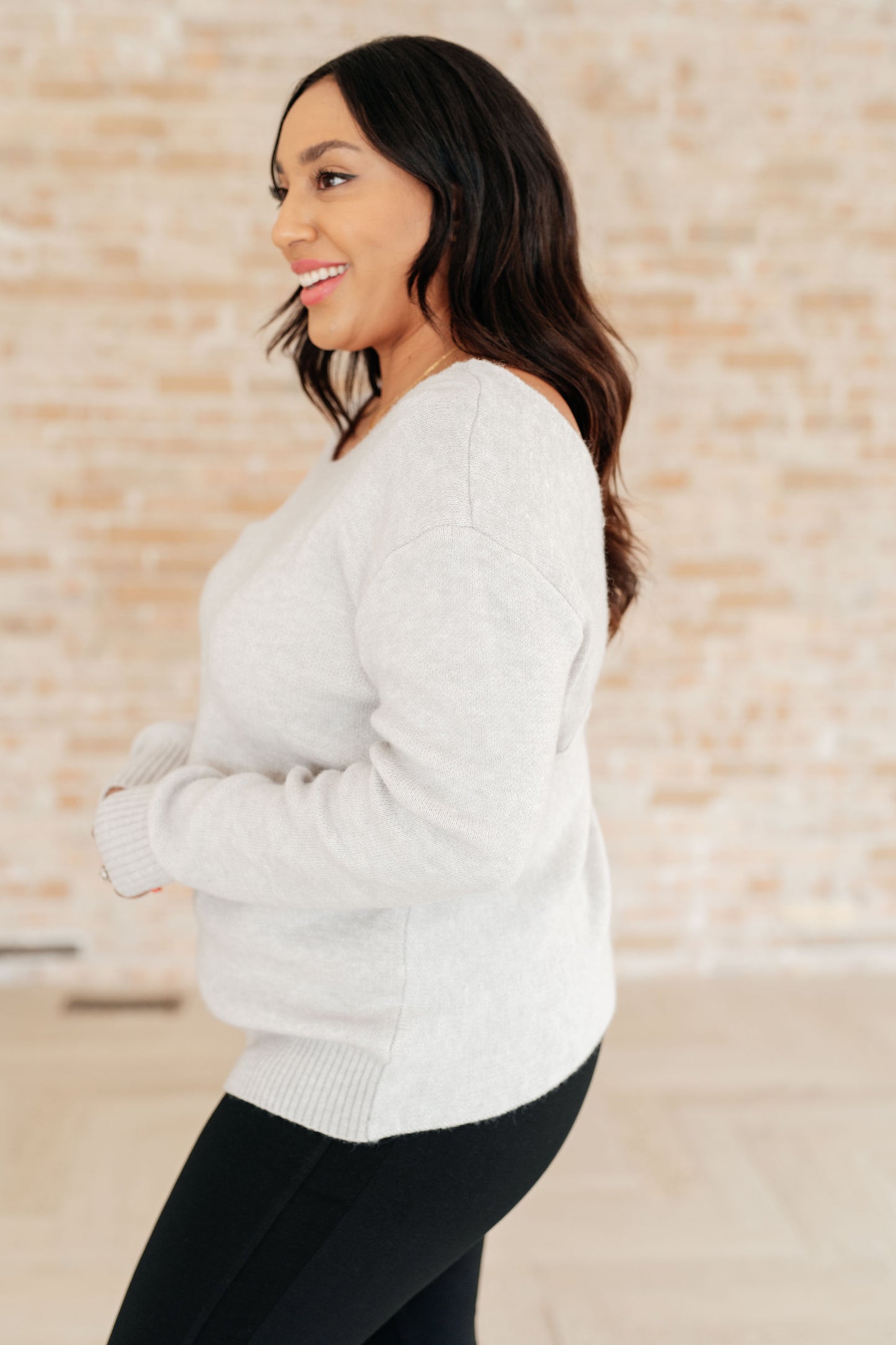 Side view of plus size Lana Sweater Top highlighting soft knit texture.
