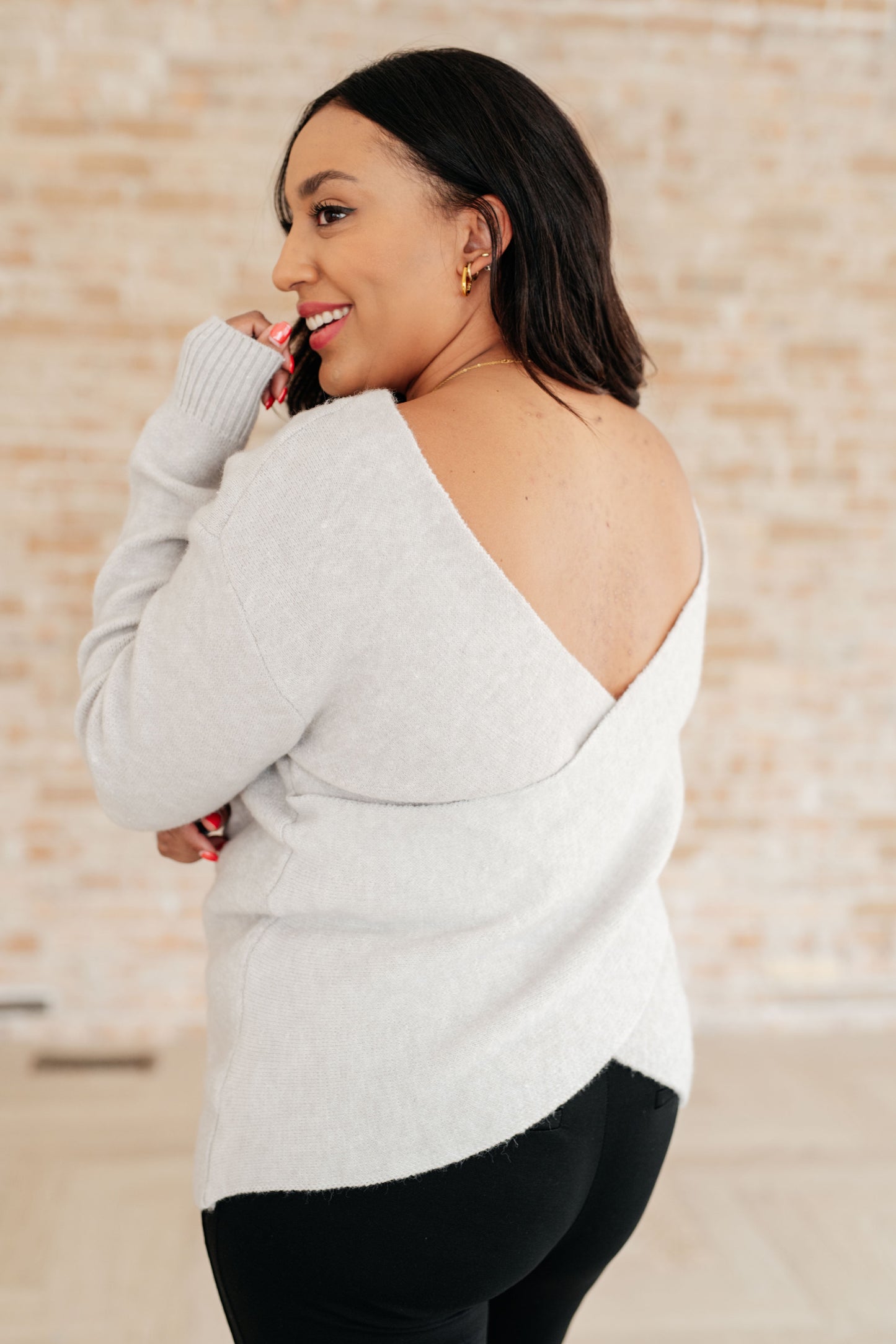 Back view of plus size Lana Sweater Top showing faux wrap detail and drape.