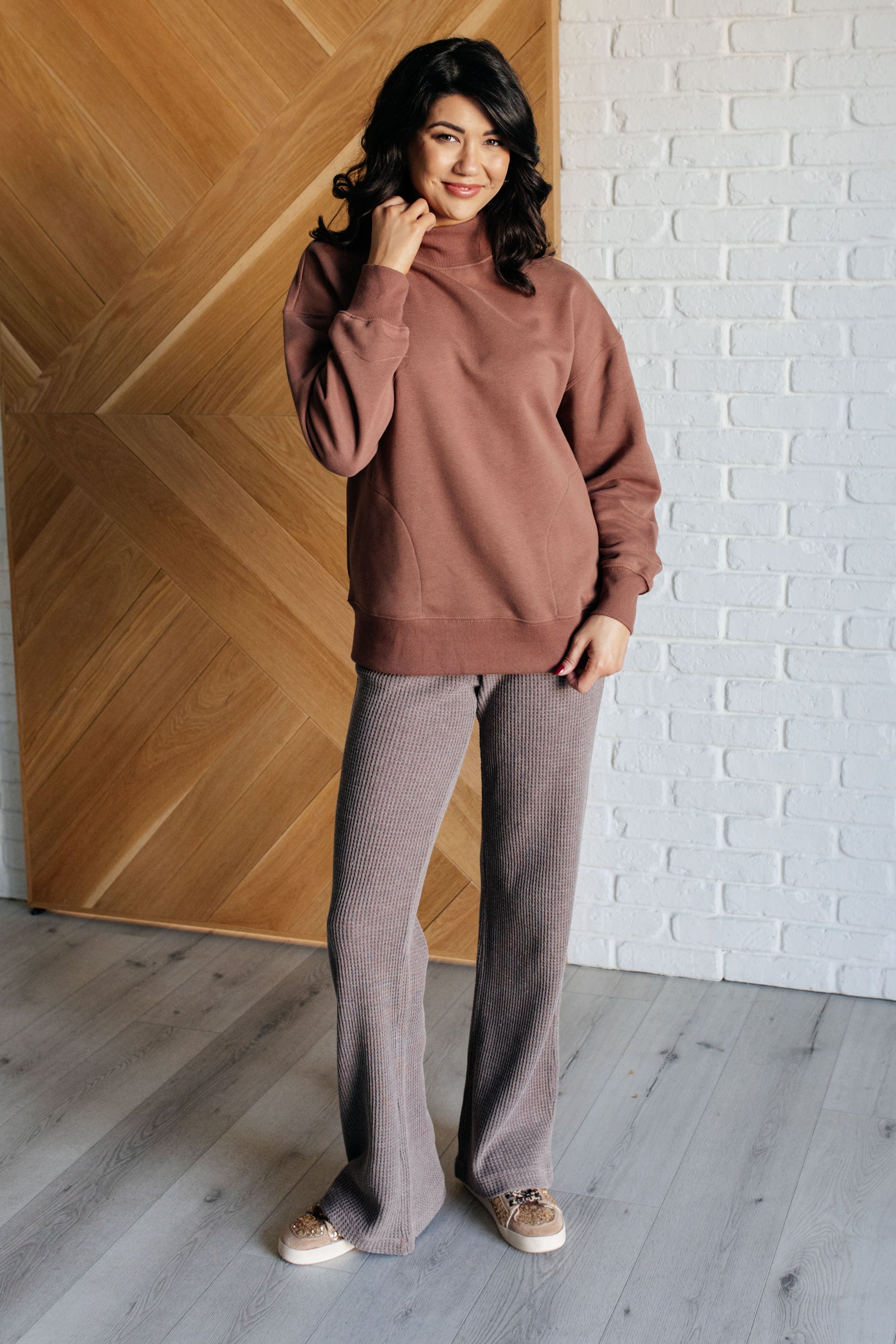 Mineral Wash Waffle Knit Pants in brown featuring a slightly wide leg silhouette, raw edge details, functional side patch pockets, and a cased elastic waistband with drawstring for a cozy, adjustable fit.