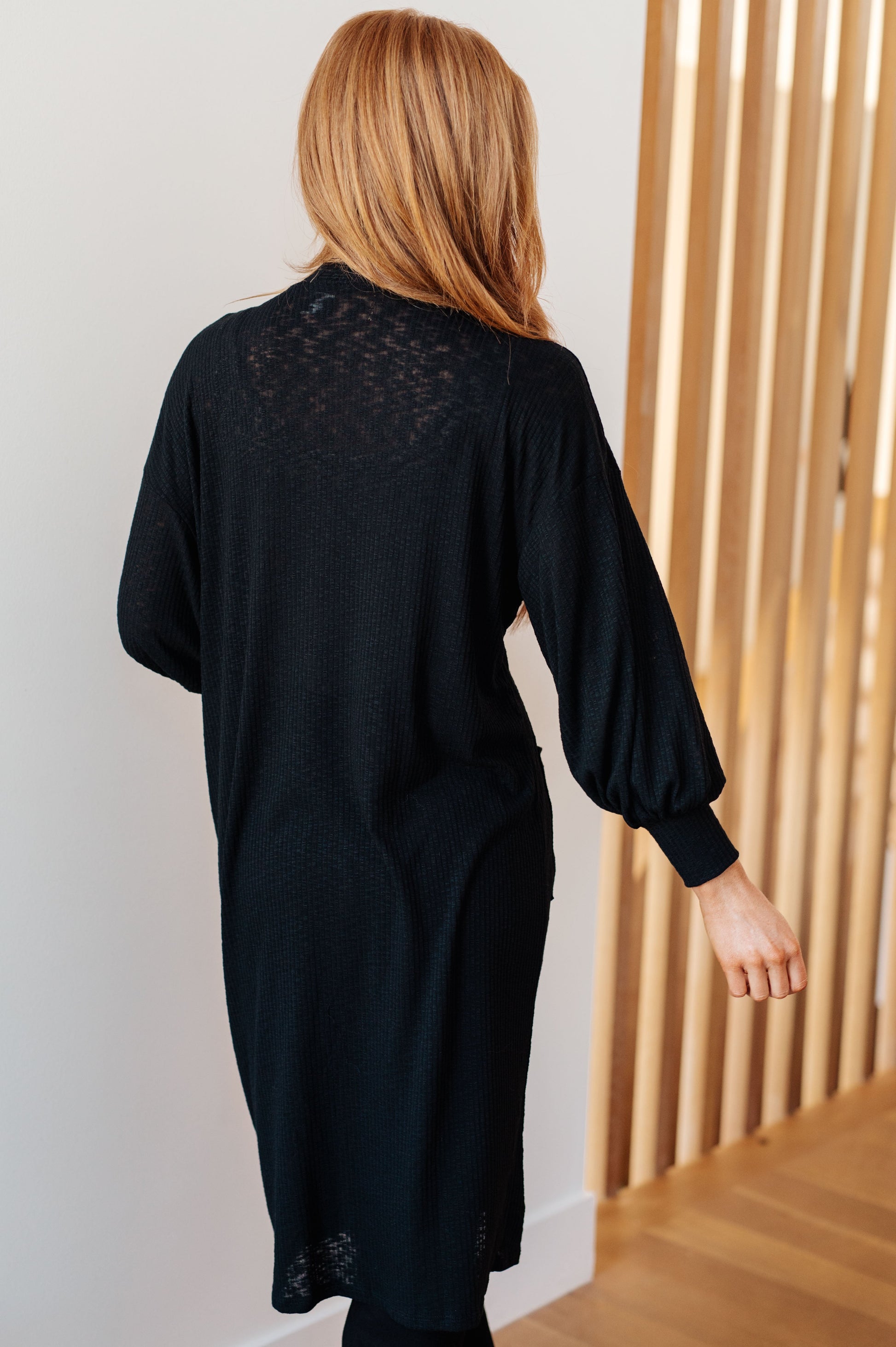 Back view of Lee Duster Cardigan in Black highlighting duster length and relaxed fit.