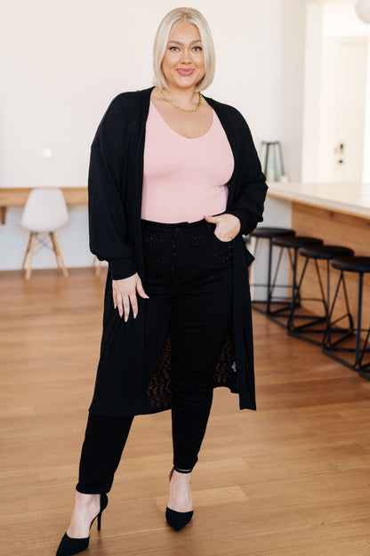 Front view of plus size Lee Duster Cardigan in Black showing ribbed knit and patch pockets.