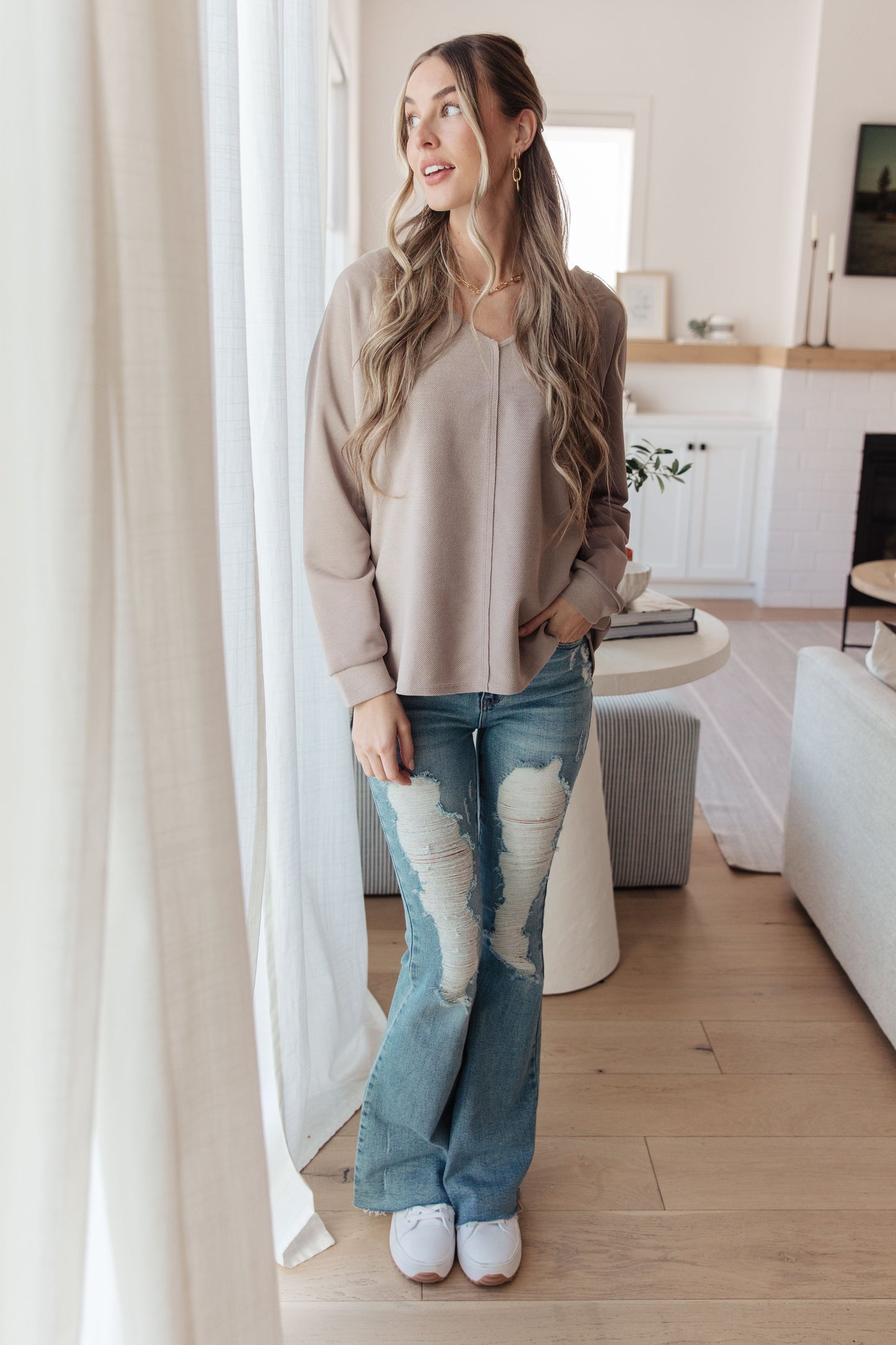 Model full body in Dominique V-Neck Top, beige textured knit with raglan sleeves