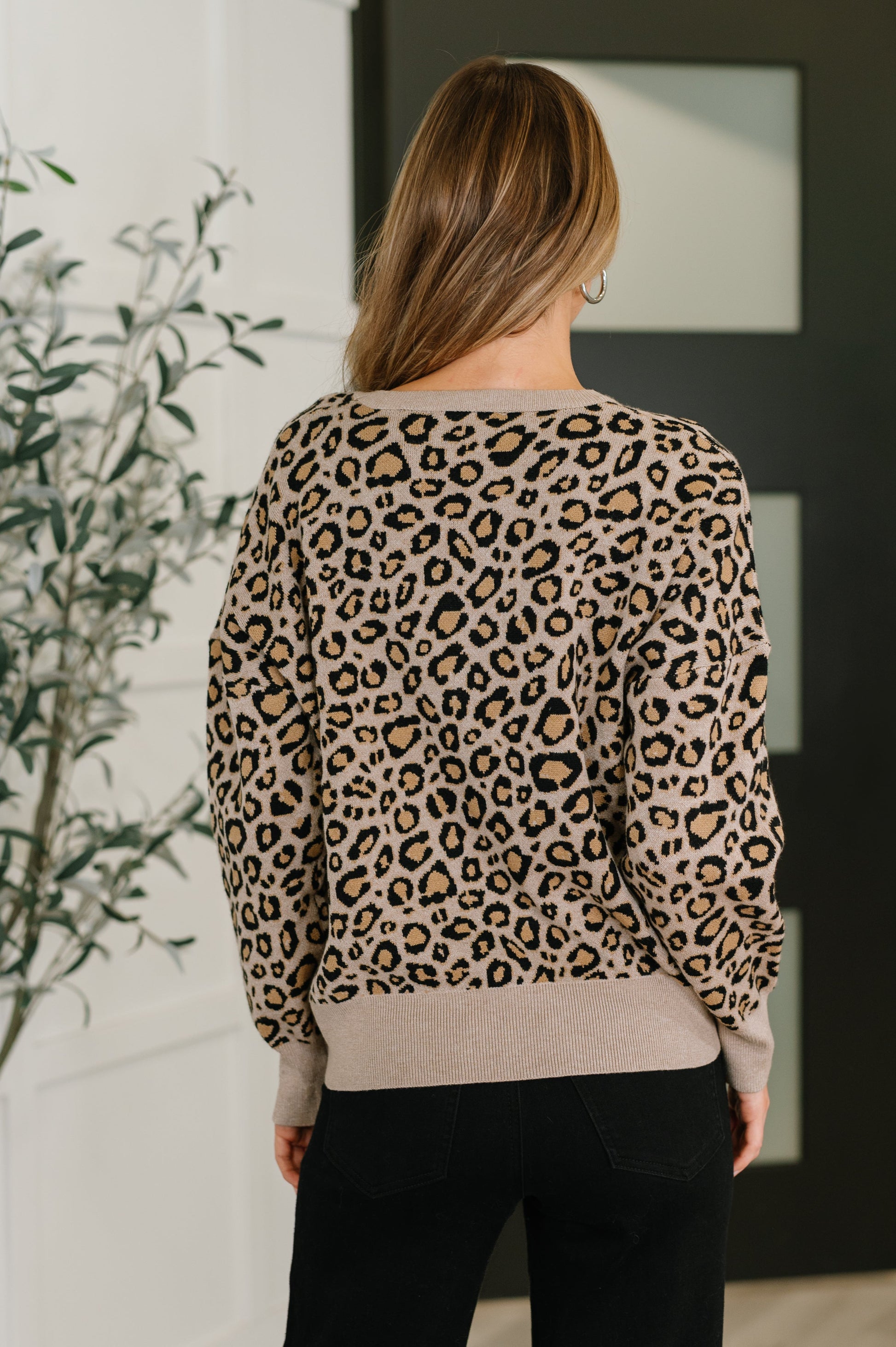 Back view of Lilith Leopard Print Pullover highlighting high-stretch mid-weight knit.