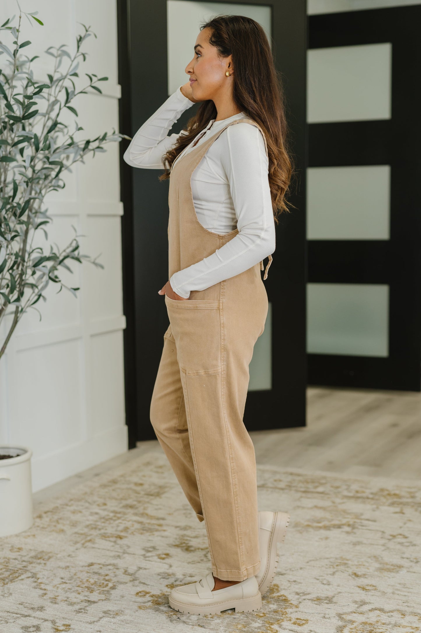 Side angle of Litzy V-Neck Jumpsuit in Brush showing relaxed silhouette, adjustable straps, and picnic-ready style.