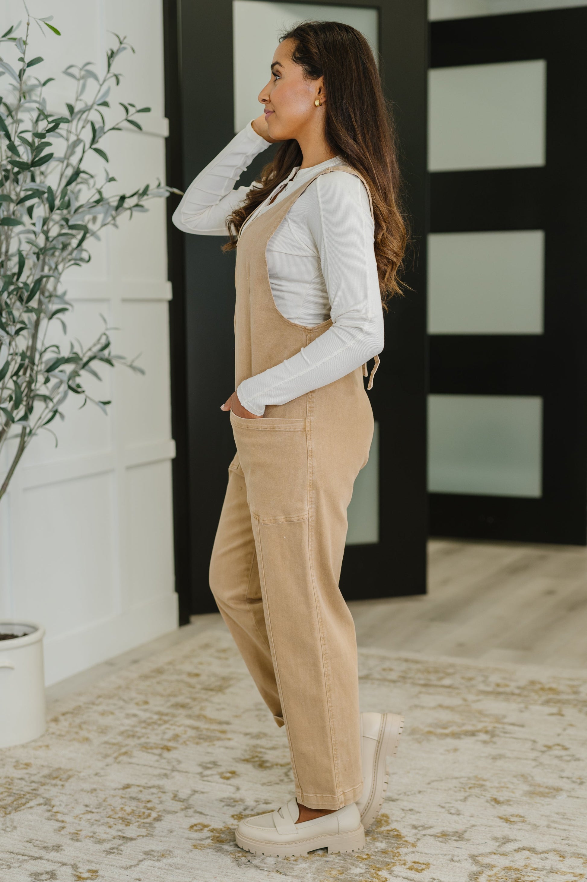 Side angle of Litzy V-Neck Jumpsuit in Brush showing relaxed silhouette, adjustable straps, and picnic-ready style.