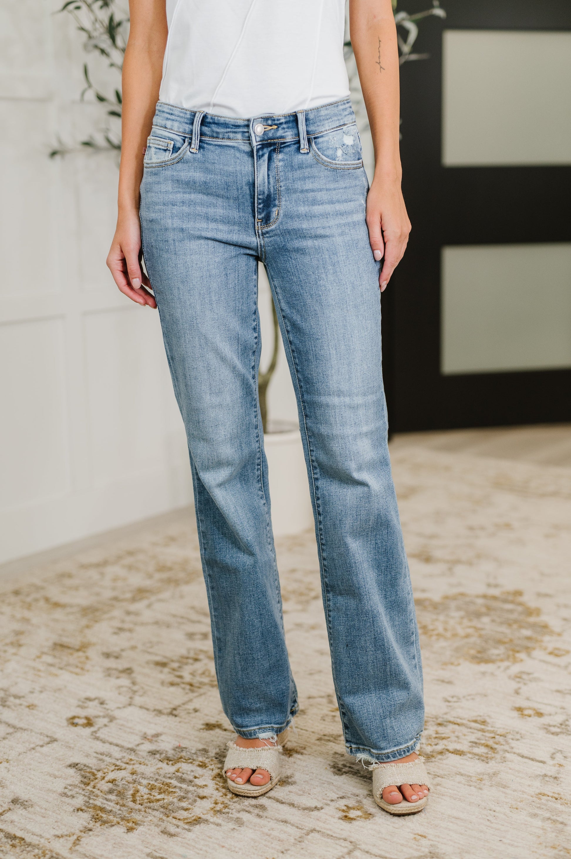 Front view of Lorena Bootcut Jeans by Judy Blue in vintage wash with mid rise fit and distressed hem.