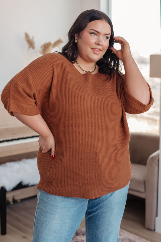 Plus size model in Zizi Rust Sweater Top, boat neckline with dolman sleeves and tacked cuffs