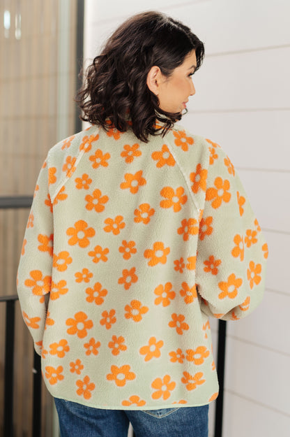 Back of Charli Floral Fleece Jacket showing allover orange floral print.
