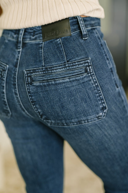 Pocket close-up of Mackenzie High Waist Flare Jeans showing stretch denim texture.
