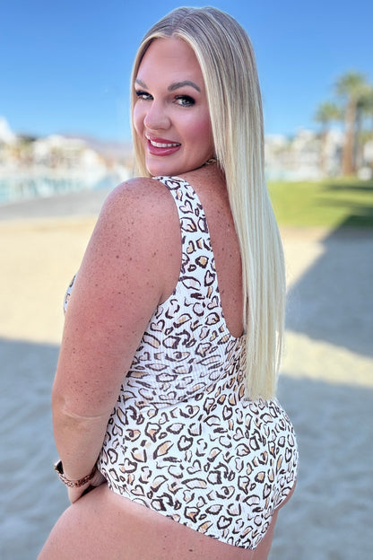 Plus size side view of Madagascar Ribbed Swimsuit, cheetah print with ribbed fabric, notched neckline, and scooped back.