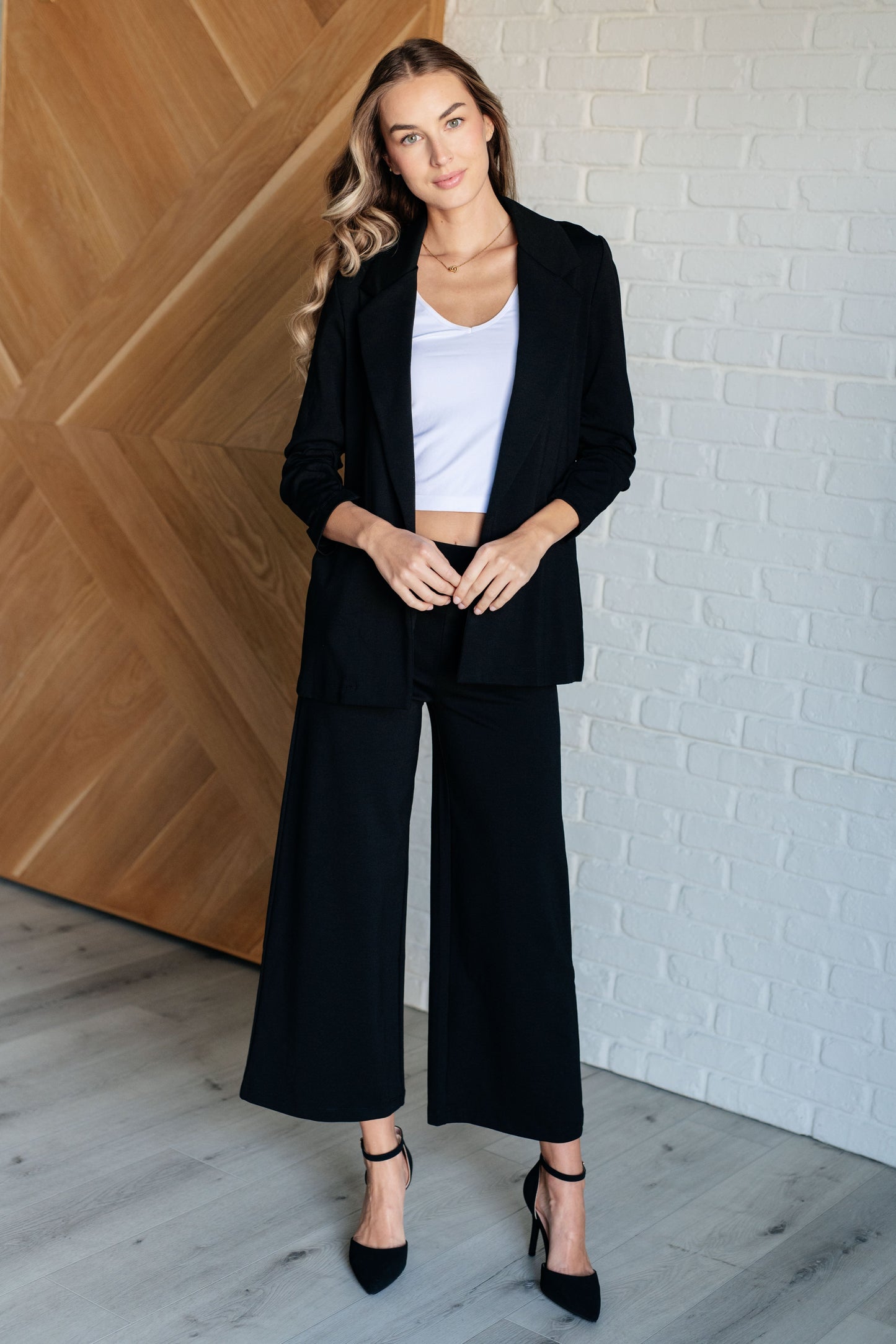 Wide Leg Crop Pants in Black, made of stretchy ponte knit with faux welt pockets, high stretch, and a chic cropped wide-leg design.