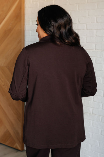 Back view plus size model wearing Devi Magic Blazer in chocolate with smooth tailored silhouette.