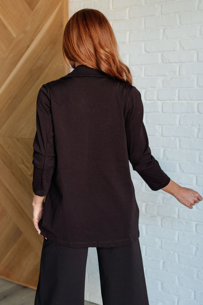 Back view of Devi Magic Blazer in chocolate, showcasing tailored fit and smooth ponte knit fabric.