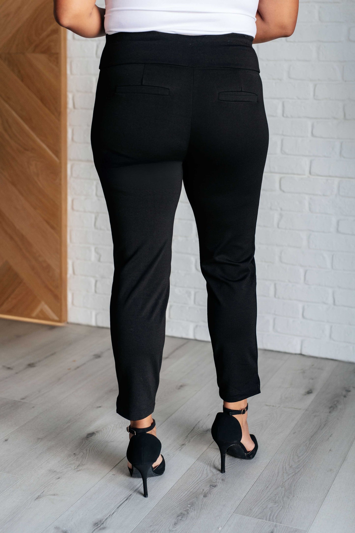 Skinny Pants in Black, high-rise slim-fit ponte knit with faux welt pockets, cuff slit, and elastic waistband for a chic, comfy look.