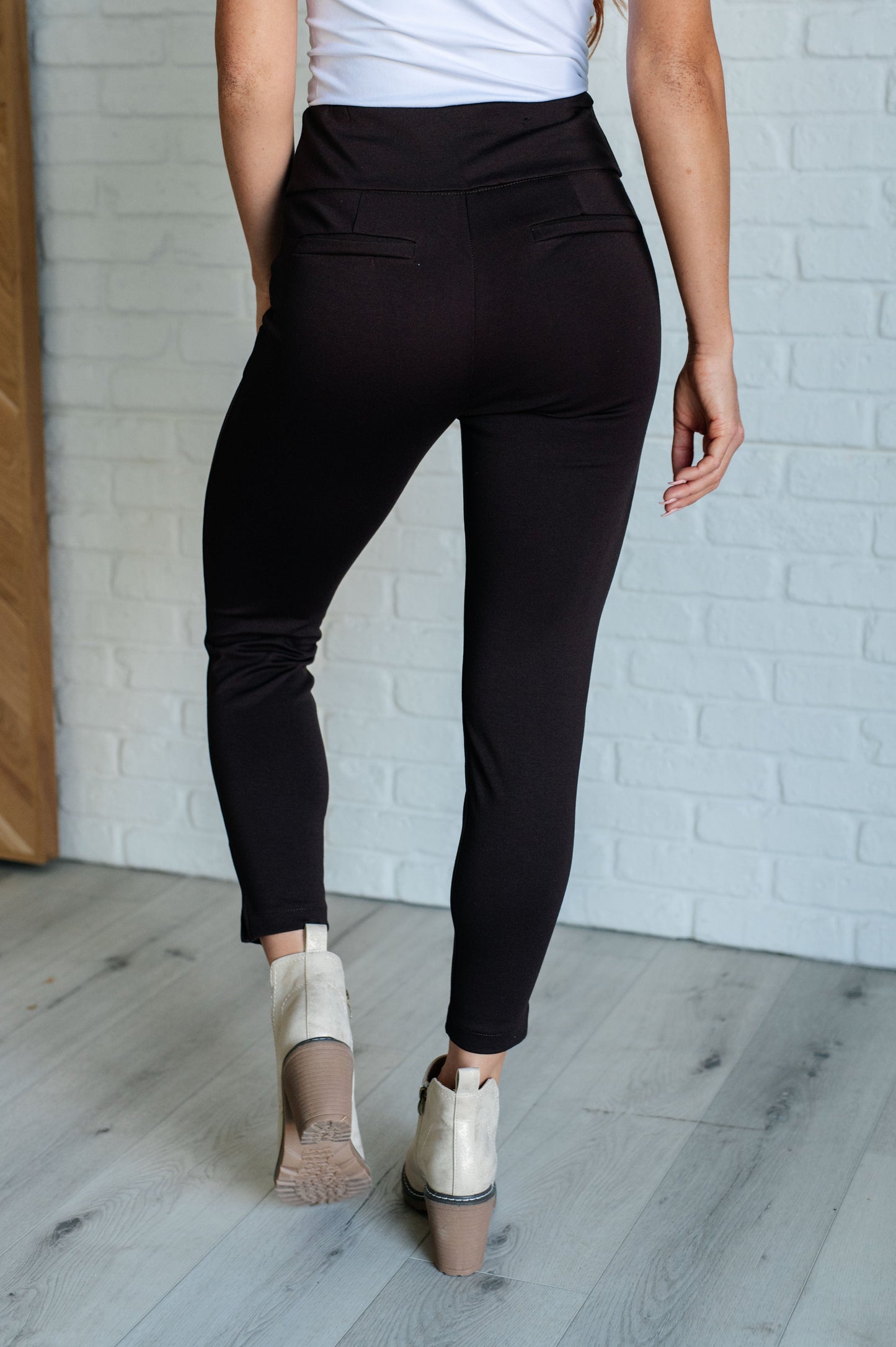 Skinny Pants in Chocolate, high-rise, slim-fit ponte knit fabric with tuxedo stripe, faux welt pockets, and ankle crop. Features elastic waistband and cuff slit.