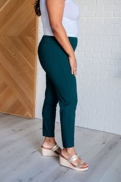 Plus size side view of Hunter Green Midge Magic Skinny Pants with sleek tuxedo stripe.