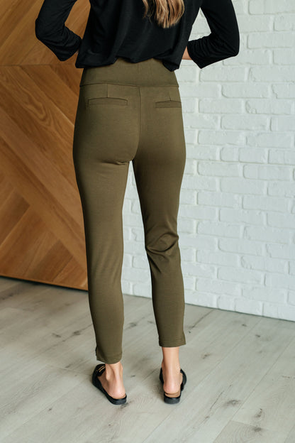 Back view of Midge Magic Skinny Pants in olive with slim fit and faux welt pocket details.