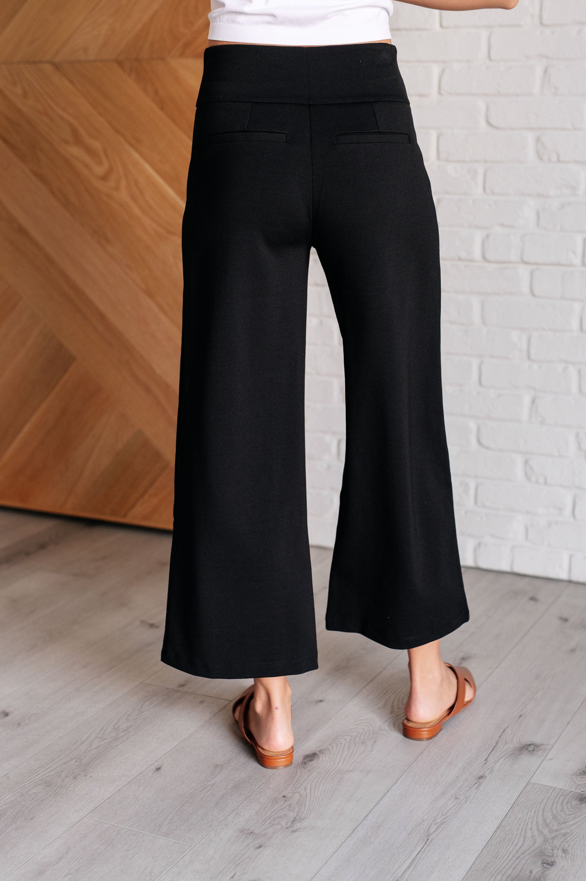 Wide Leg Crop Pants in Black, made of stretchy ponte knit with faux welt pockets, high stretch, and a chic cropped wide-leg design.