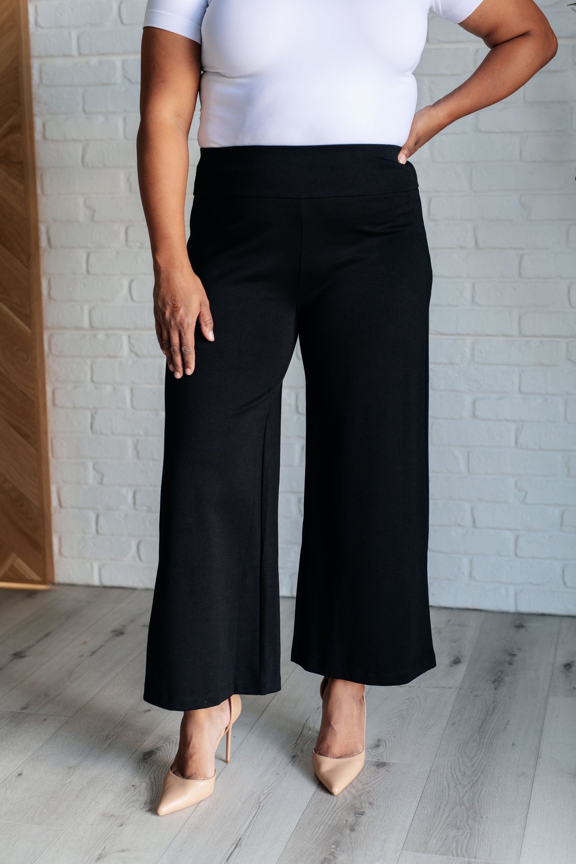 Wide Leg Crop Pants in Black, made of stretchy ponte knit with faux welt pockets, high stretch, and a chic cropped wide-leg design.