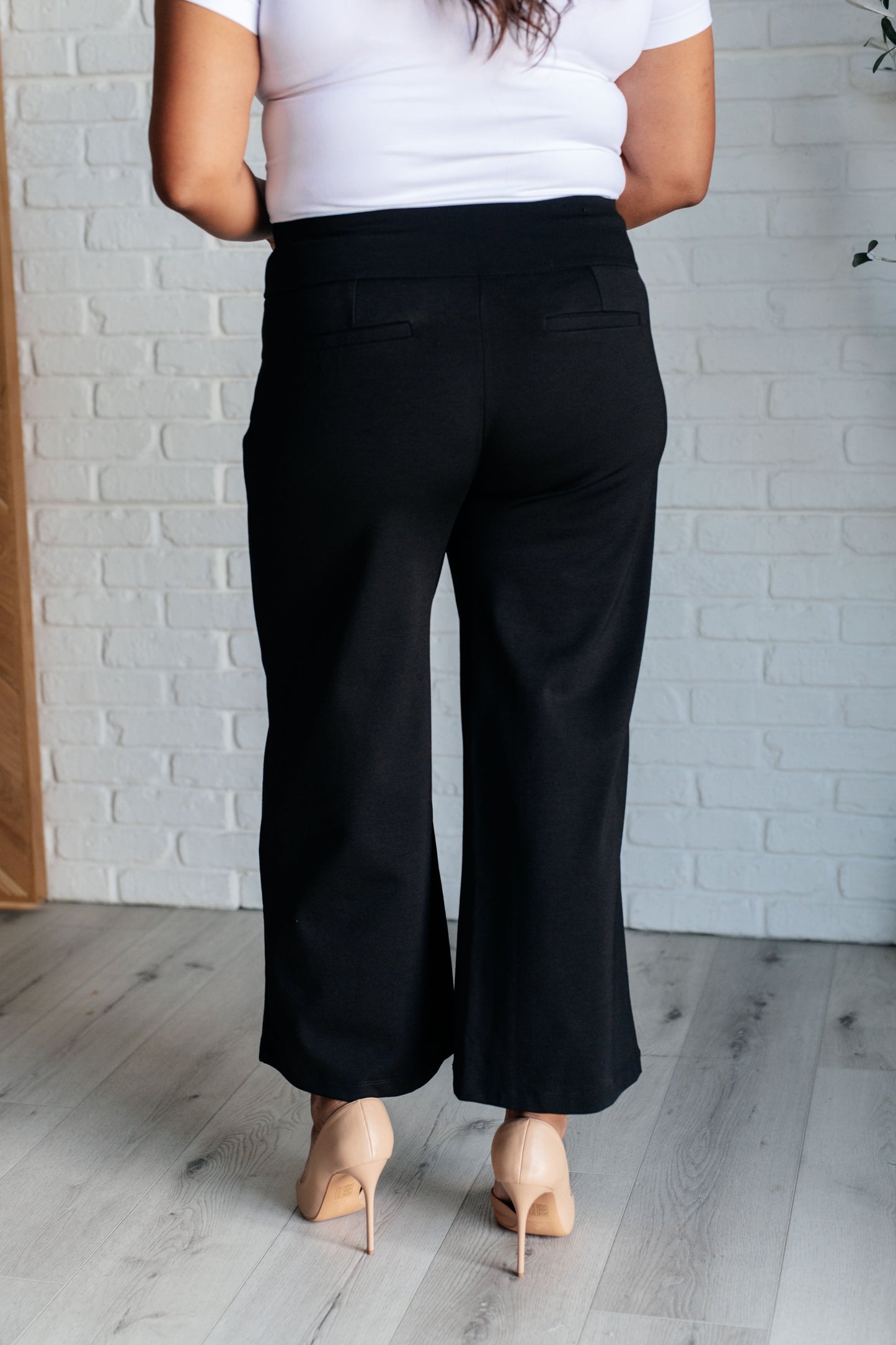 Wide Leg Crop Pants in Black, made of stretchy ponte knit with faux welt pockets, high stretch, and a chic cropped wide-leg design.