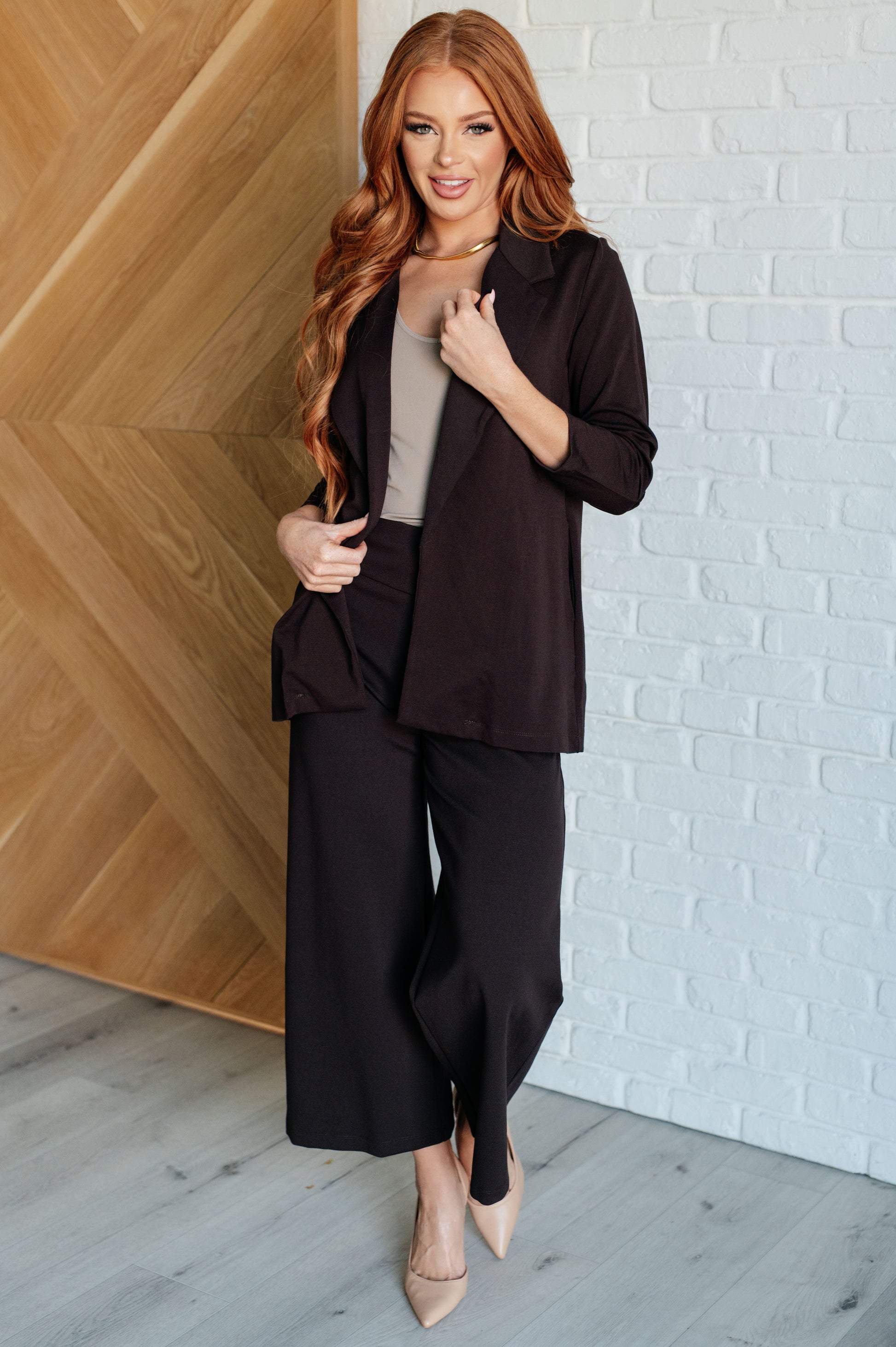 Wide Leg Crop Pants in chocolate, made from stretchy ponte knit fabric. Featuring a wide-leg design, cropped length, and faux welt pocket for a chic, comfortable look