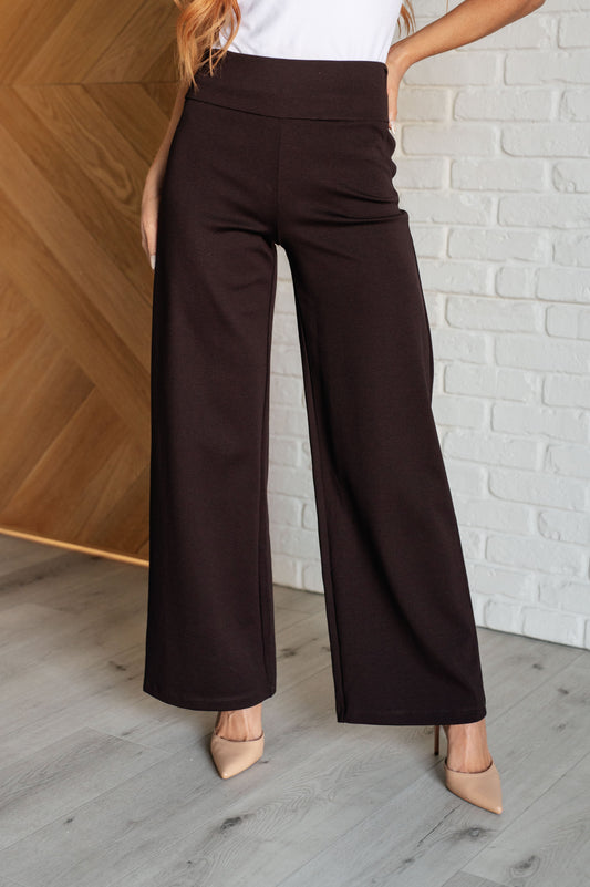 Wide Leg Pants in chocolate, made from high-stretch ponte knit fabric, featuring faux welt pockets and a flattering wide leg silhouette.