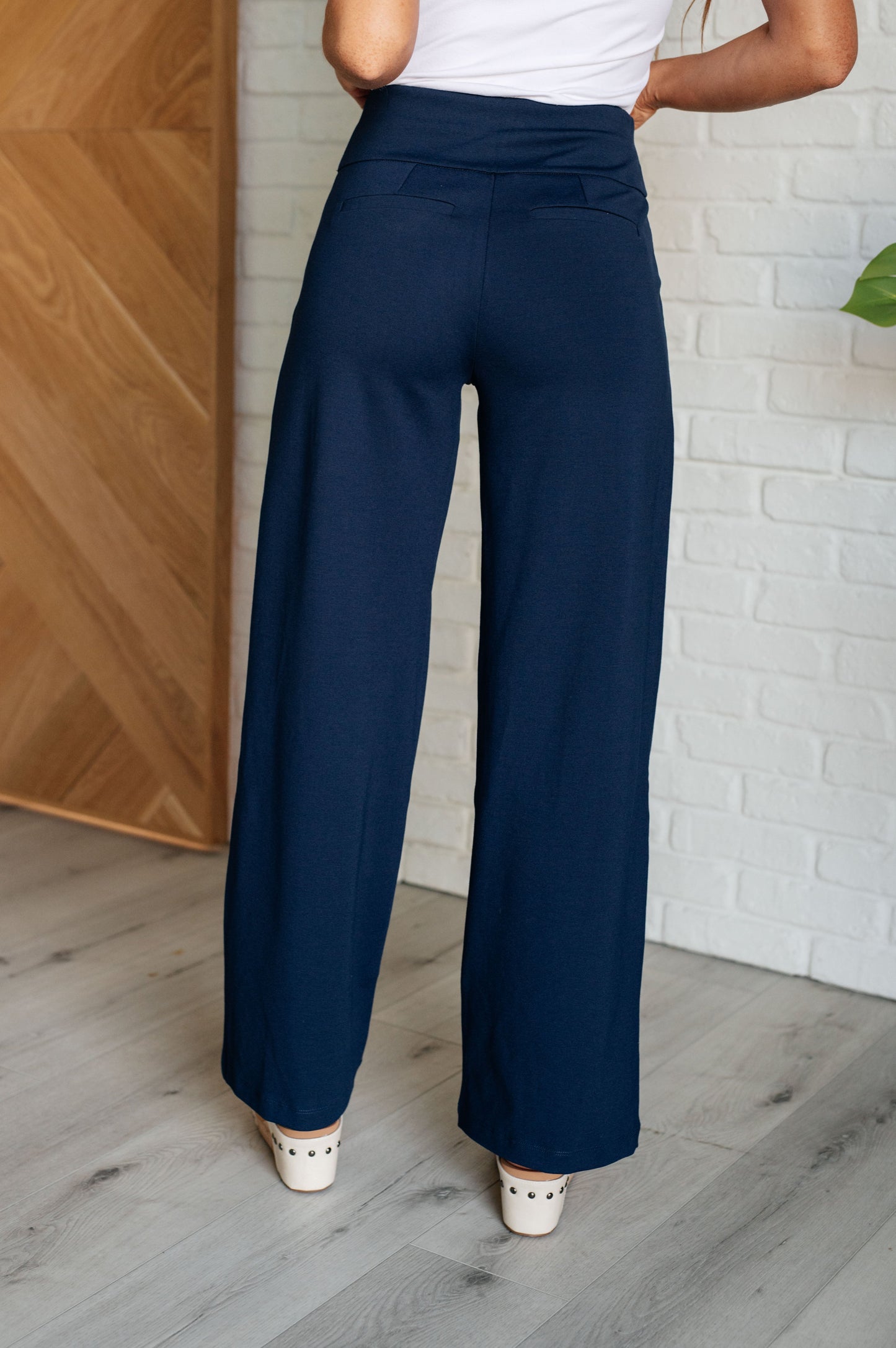 Wide Leg Pants in navy, made from high-stretch ponte knit fabric, featuring faux welt pockets and a flattering wide leg silhouette.