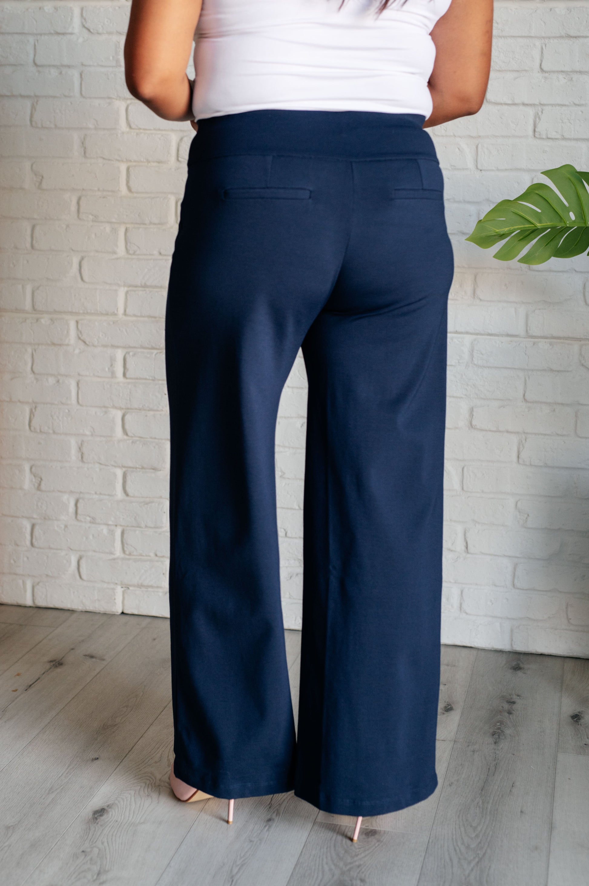 Wide Leg Pants in navy, made from high-stretch ponte knit fabric, featuring faux welt pockets and a flattering wide leg silhouette.