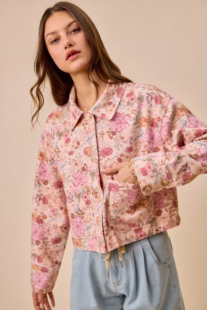 Model wearing Maisie Floral Barn Jacket blush pink with cotton twill and floral print.