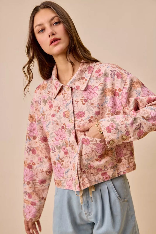 Model wearing Maisie Floral Barn Jacket blush pink with cotton twill and floral print.