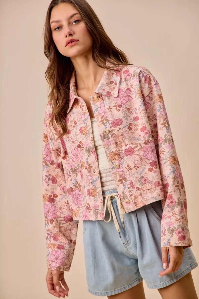 Detail shot of Maisie Floral Barn Jacket button closure and pockets.