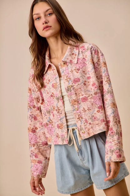 Detail shot of Maisie Floral Barn Jacket button closure and pockets.