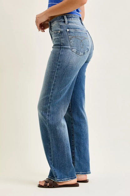 Angled view of Mandy Mid Rise 90s Straight Jeans by Judy Blue flattering fit.