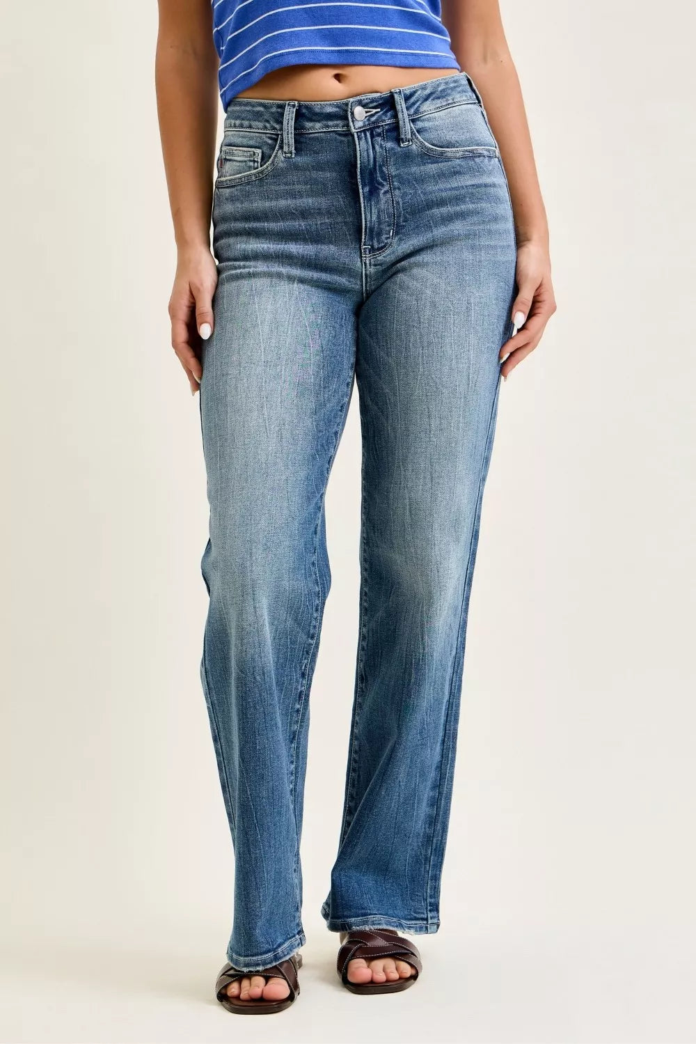 Model wearing Mandy Mid Rise 90s Straight Jeans by Judy Blue medium wash straight leg denim.