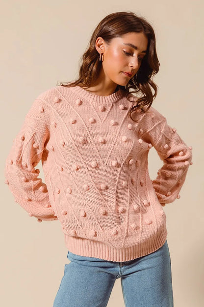 Blush Marcella Pom Pom Sweater top neckline detail showing round neck and ribbed knit texture.