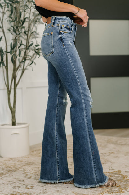 Side view of Marion Mid Rise Flare Jeans showing flare silhouette and medium wash.