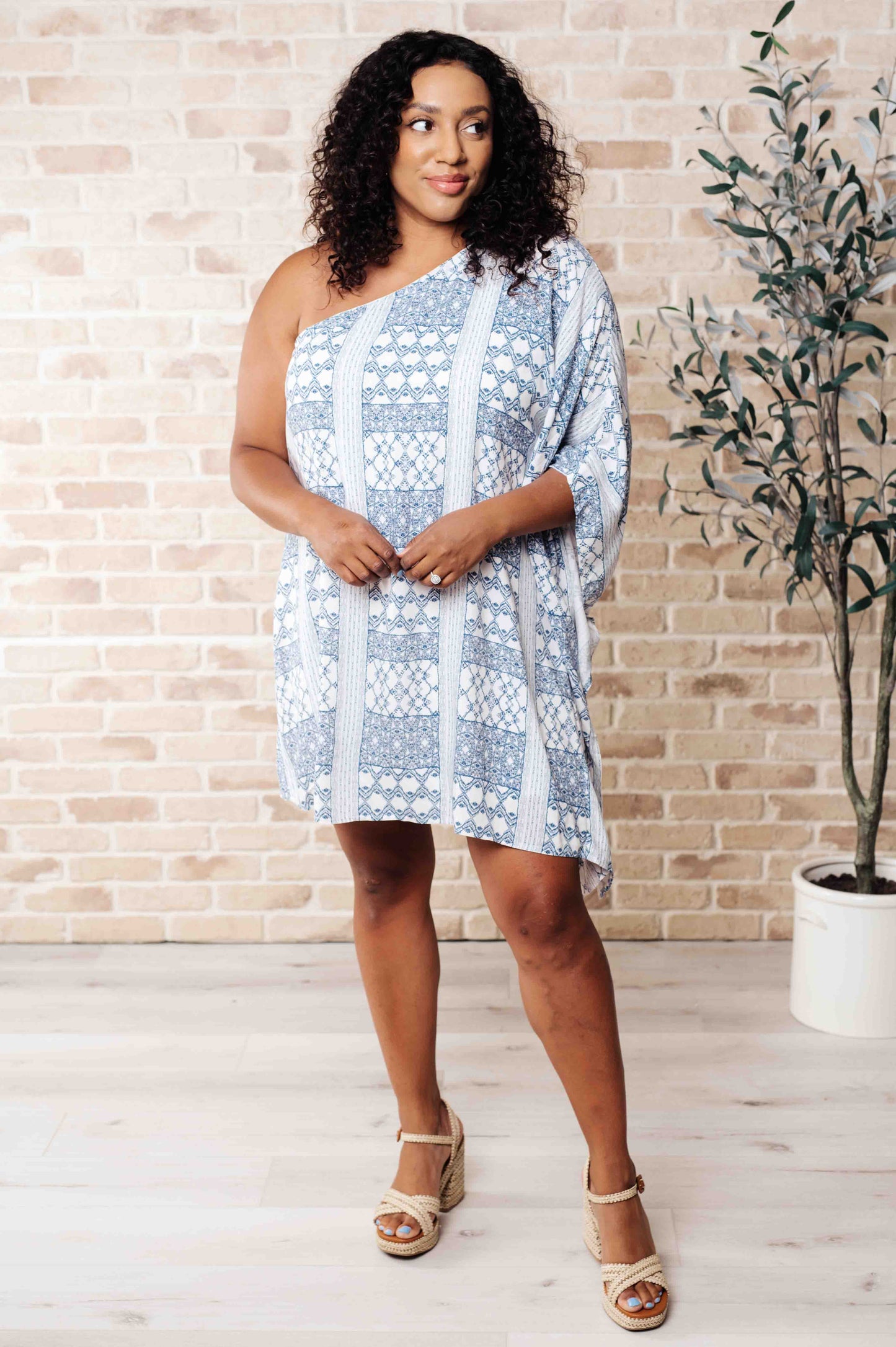 Front view of plus size model wearing Marjorie One Shoulder Blue Dress with contrasting print, styled for a stunning night-out look.