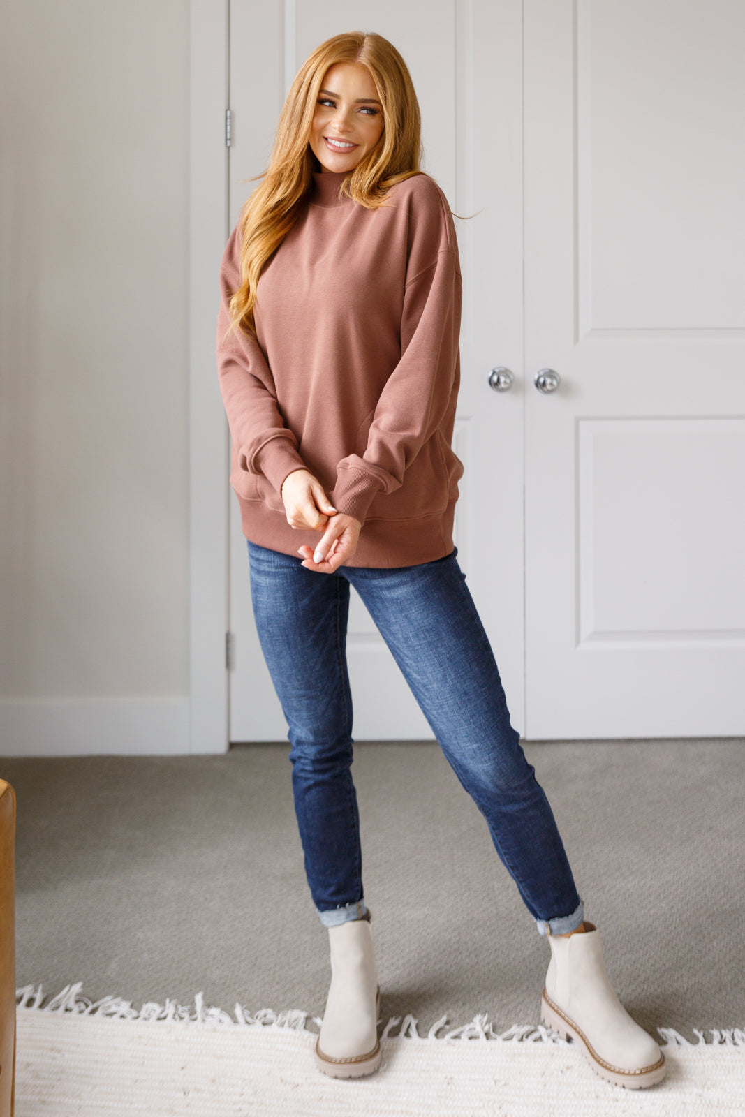 Model wearing cocoa Marnie pullover front view with relaxed fit and cozy style.