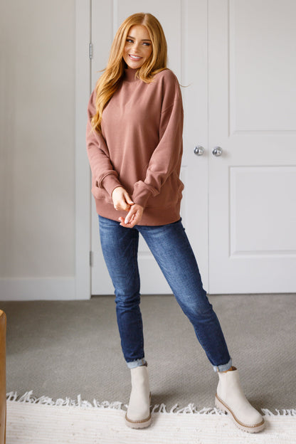 Model wearing cocoa Marnie pullover front view with relaxed fit and cozy style.