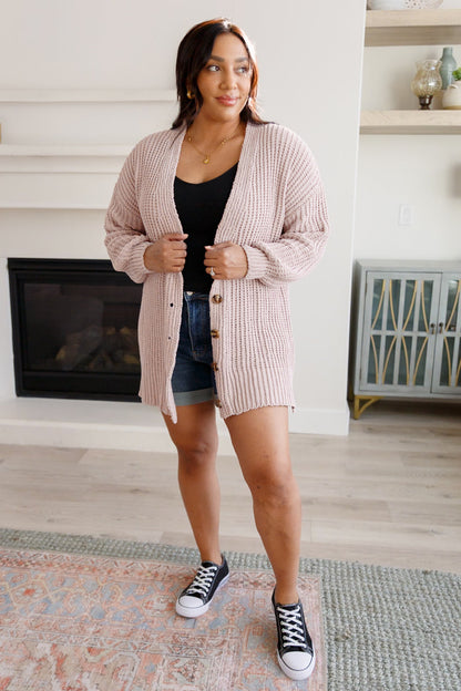 Plus size model pairing Martha Buttoned Down Cardigan with casual layers.