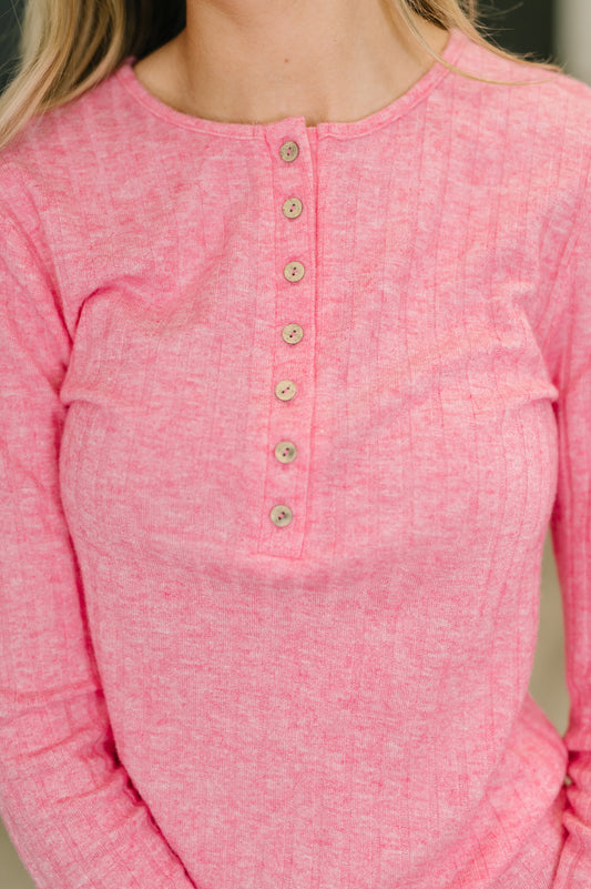 Close up of Meghan Ribbed Long Sleeve in Fuchsia ribbed texture and wood hardware.