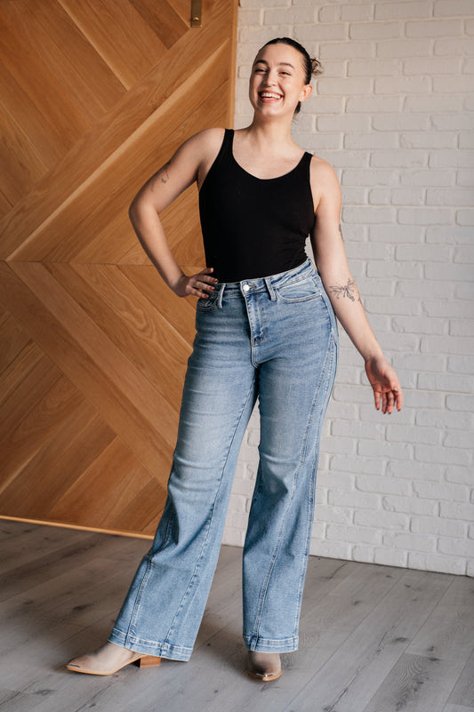 Melia High Rise Side Seam Detail Wide Leg Jeans by Judy Blue in a light wash, featuring a retro-inspired wide-leg silhouette, high-rise fit, asymmetrical side seam detail, zip fly closure, and 4-way stretch for comfort and style.