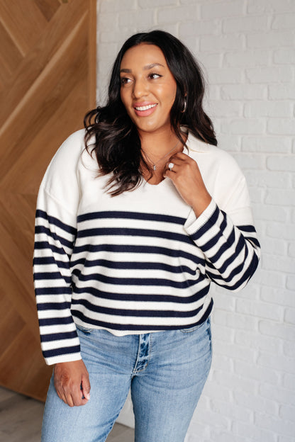 Plus size model wearing Octavia Striped Sweater with collared V-neck and cropped design.