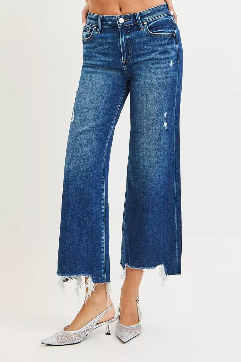Model wearing Molly High Rise Crop Wide Leg Jeans by Risen dark wash cropped denim.