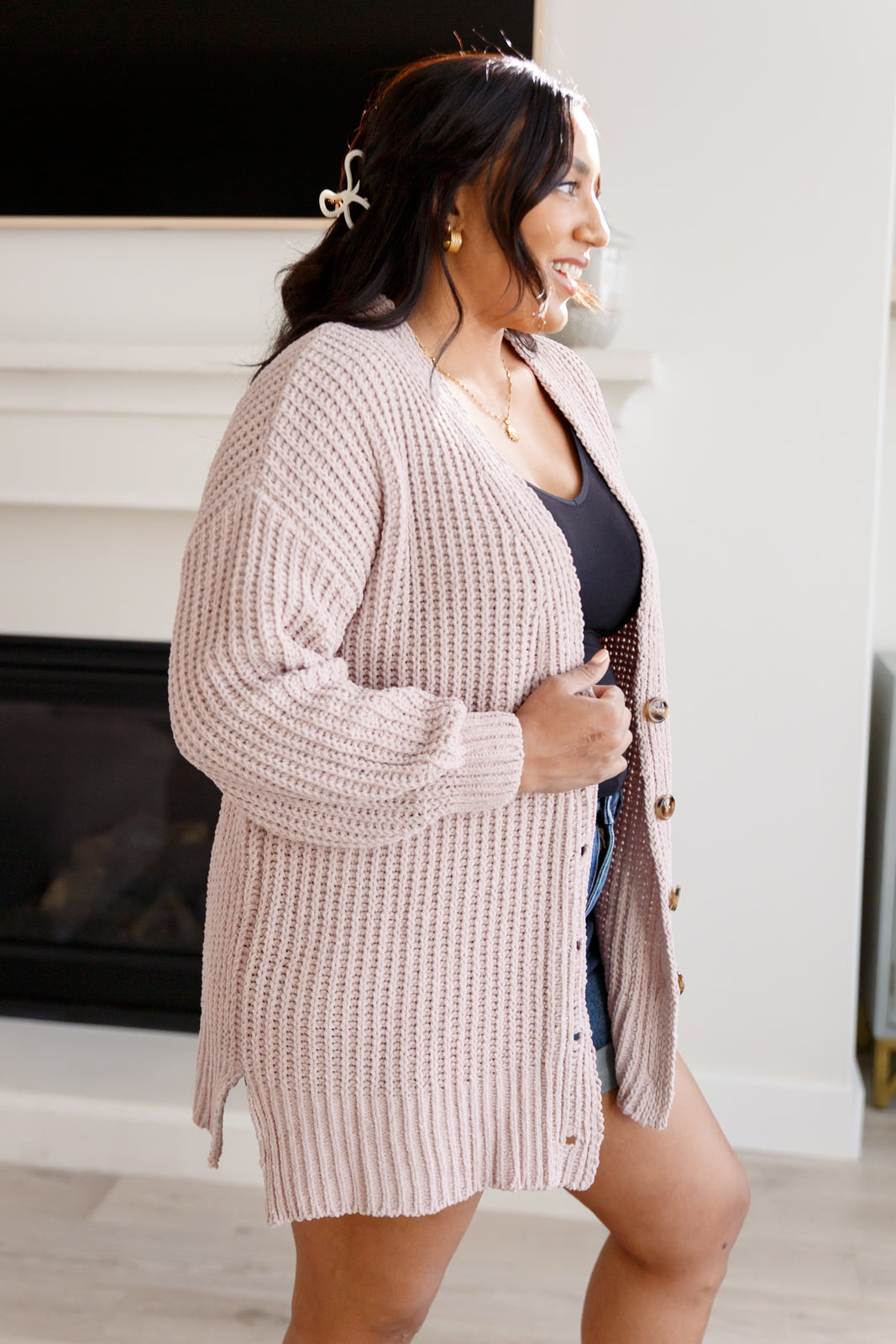 Side angle of plus size Martha Buttoned Down Cardigan highlighting drop shoulders.