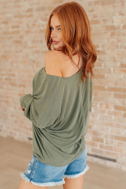 Side view of Micah Sage Long Sleeve Top paired with neutral bottoms for everyday style