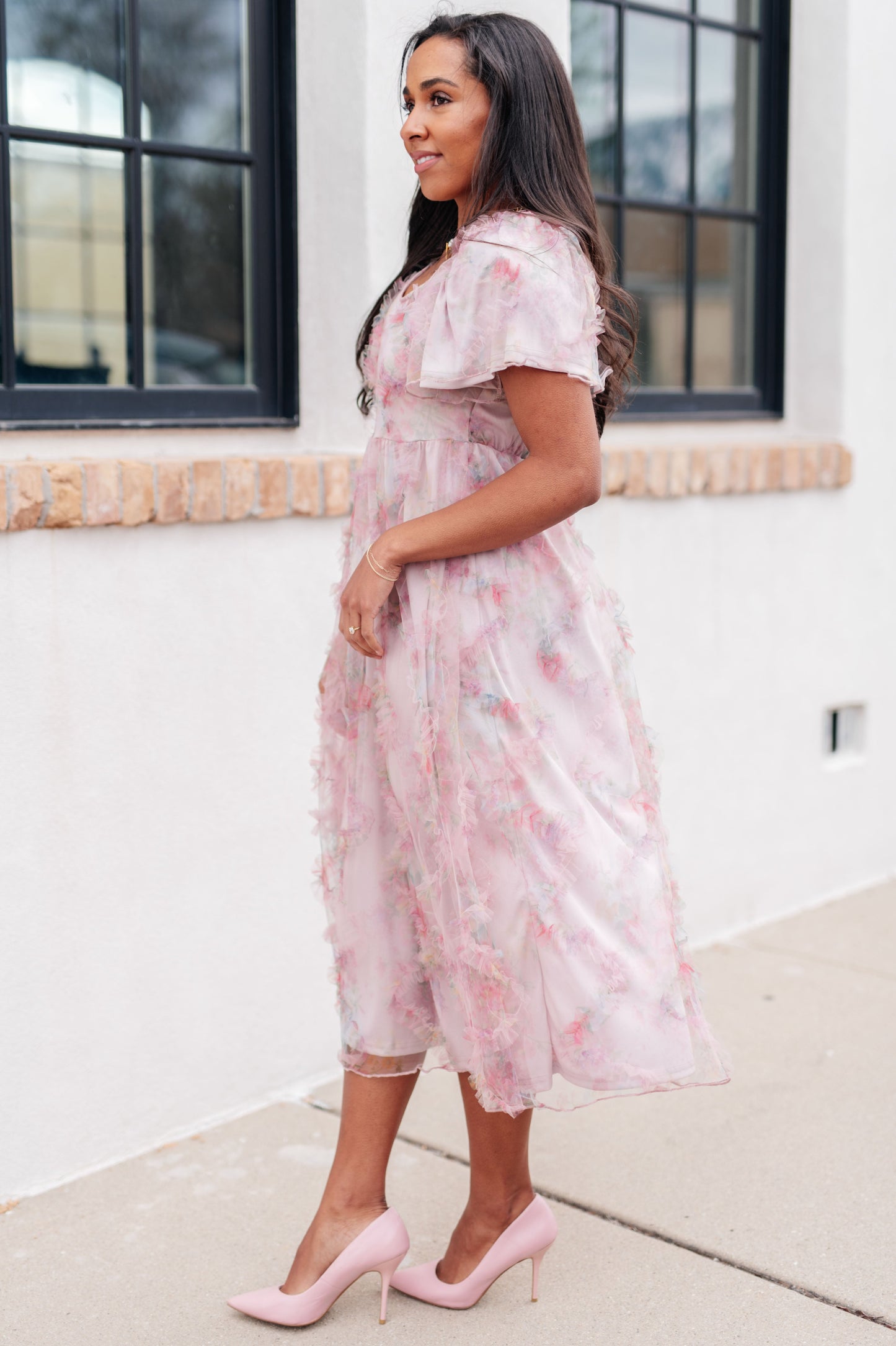 Side view of Malia Flutter Sleeve Dress showcasing soft flutter sleeves and flowing silhouette
