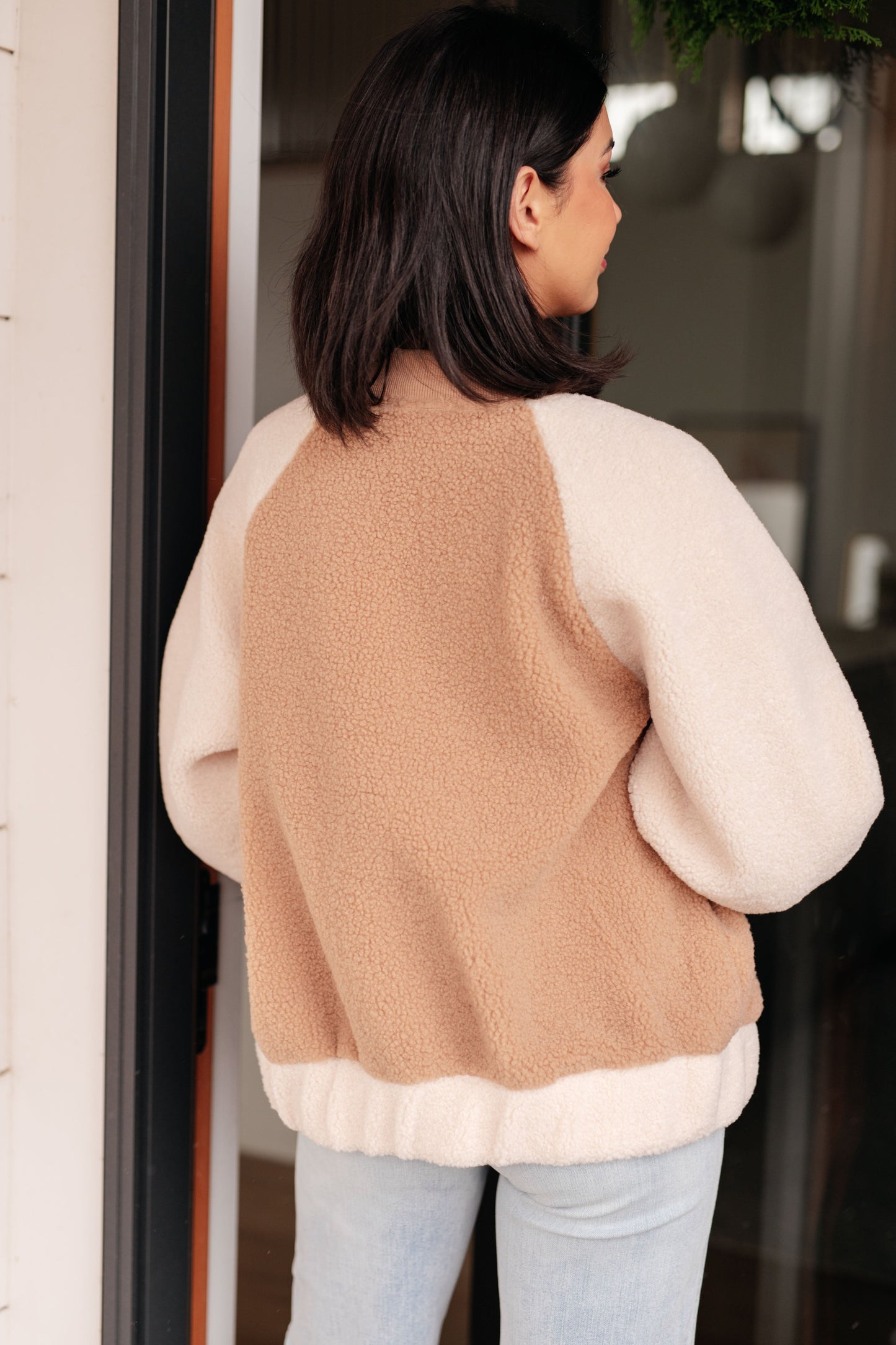 Back view of Mia Teddy Bomber Jacket in brown showing relaxed fit and plush fleece design.