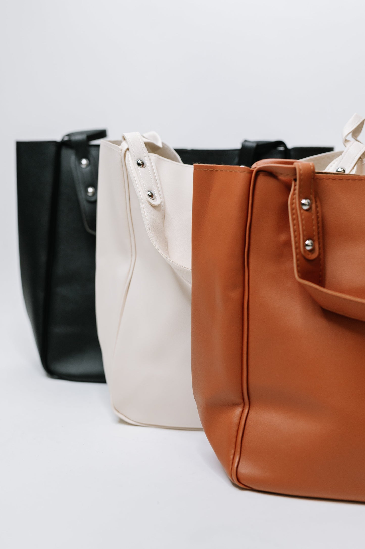 My Whole Life Shoulder Bag in Black with silver hardware and faux leather finish - Available in Black, Brown and Beigr.